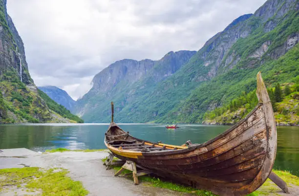 Viking boat on the coast of the Nereyfjord, Gudvangen. Located is near Viking village Njardarheimr in Gudvangen. Norway.