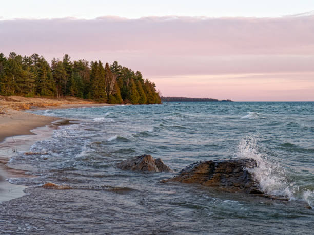 istock Waves crashing on rocks during a stunning sunset 1202493570