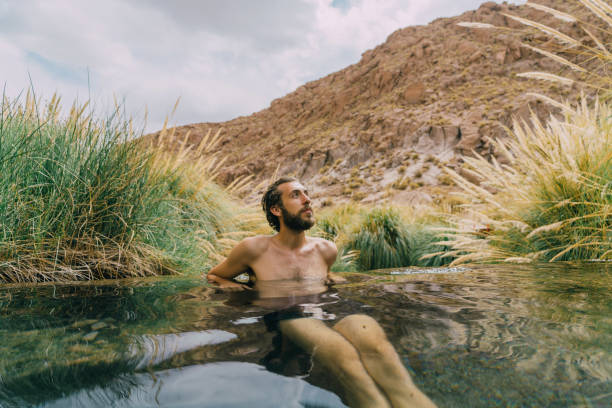istock Man in hot spring in Atacama desert 1202494048
