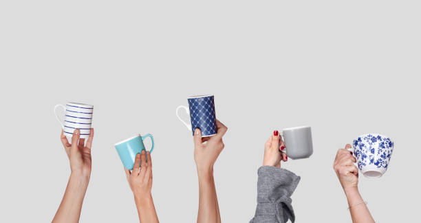 istock many hands with cup of coffee isolated 1202495895