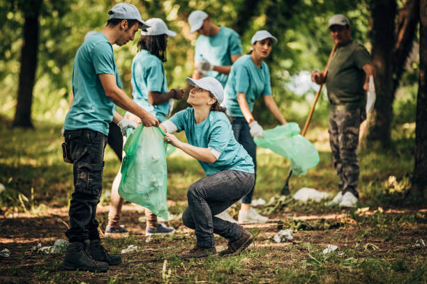 istock Volunteers with garbage bags 1202496622
