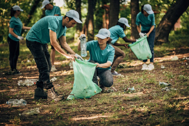 istock Volunteers with garbage bags 1202497211