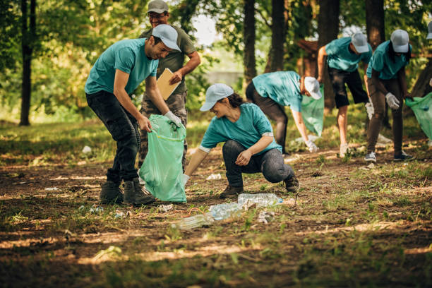 istock Volunteers with garbage bags 1202497470