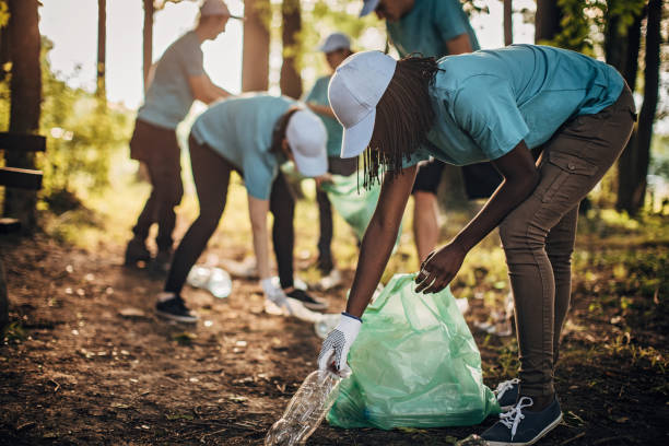 istock Volunteers cleaning park 1202497853