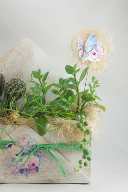 istock Flower arrangement in a wooden envelope 1202498699