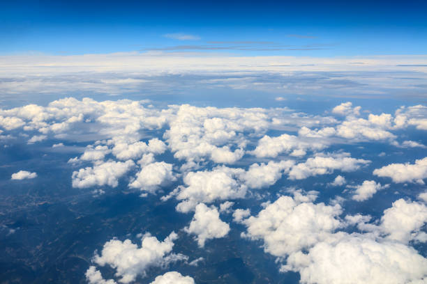 istock High blue sky and various shapes of white clouds 1202499501