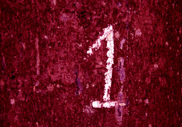 istock Hand written number one on pink grungy wall. 1202500227