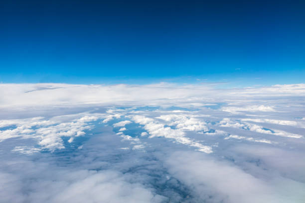 istock High blue sky and various shapes of white clouds 1202500278