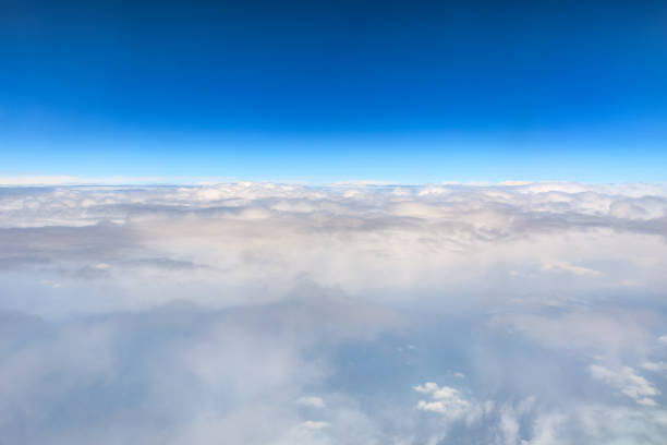 istock High blue sky and various shapes of white clouds 1202502201