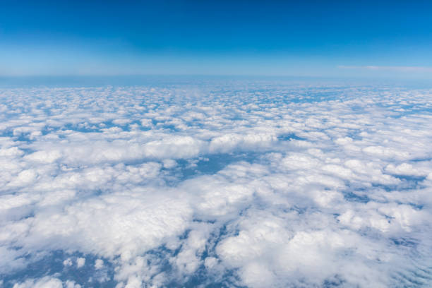 istock High blue sky and various shapes of white clouds 1202502333