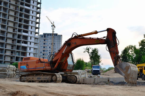 istock Tracked excavator working at a construction site during laying or replacement of underground storm sewer pipes 1202504252