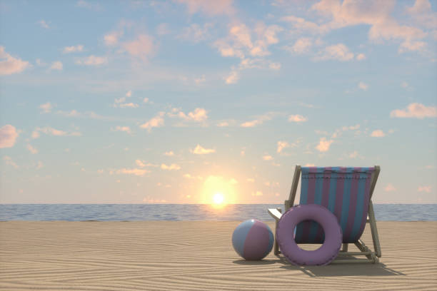 Lounge Chair on sunny day at beach. Sunset over the sea. Taken brightly lit from low angle view and rear view with copy space close to Leeuwarden, Friesland, Netherlands.