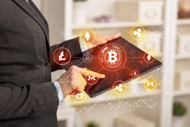 istock Business woman using tablet with bitcoin link network concept 1202505839