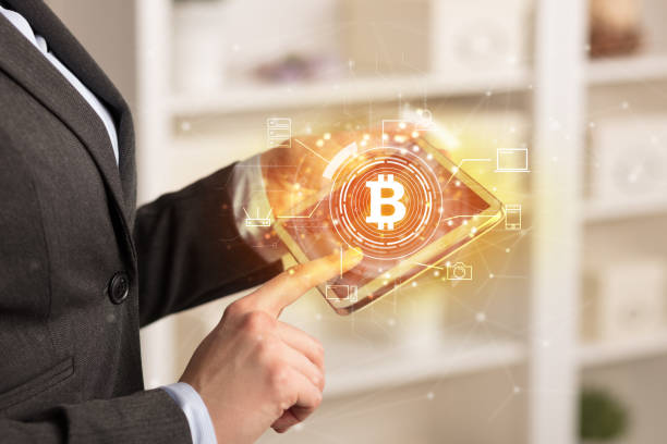 istock Business woman using tablet in home office mood with bitcoin link network concept 1202505878