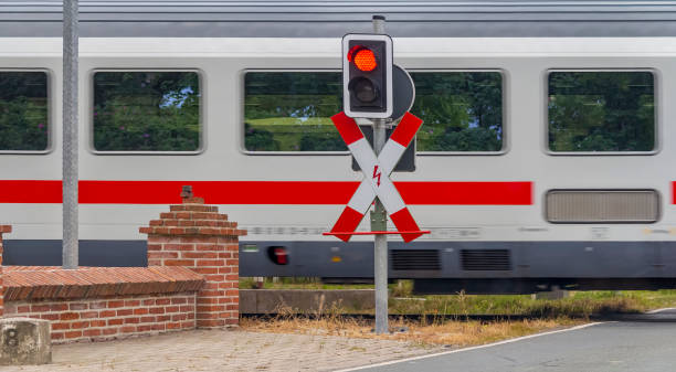 level crossing level crossing scenery including a train, road sign and traffic light 30132 stock pictures, royalty-free photos & images