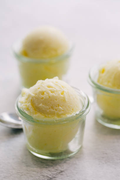 istock Yellow ice cream served in glass 1202511464