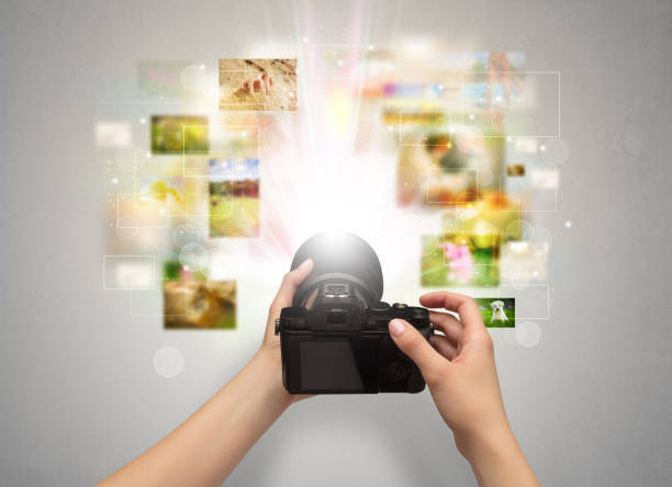 Hand captures life events with digital camera