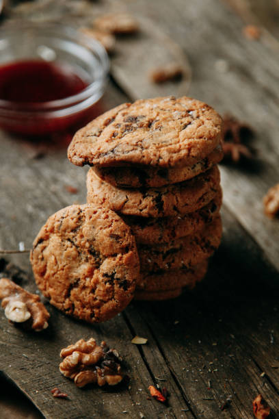 istock Oatmeal cookies with jam. Croissants with raspberry jam. Baking on a Flatley wooden background. 1202512178