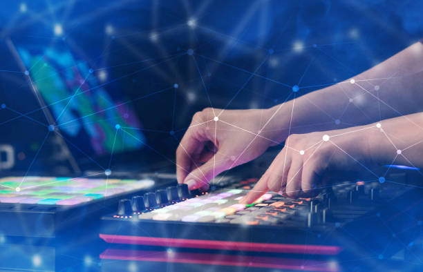 istock Hand mixing music on midi controller with connectivity concept 1202512210