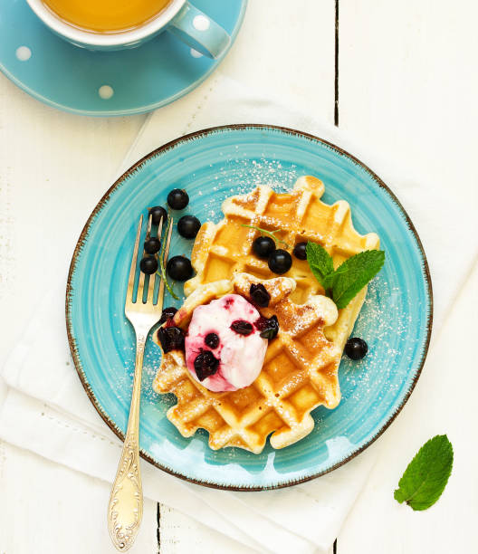 istock Homemade waffles with a sprig of currants. White background. 1202513008