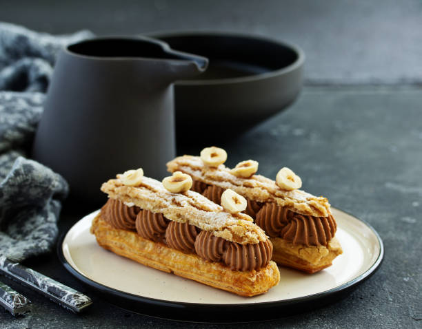 istock Homemade eclair with chocolate and nuts. Pastry. 1202514786