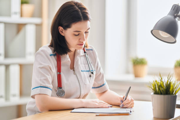 istock doctor is working in office. 1202515850