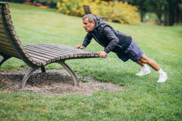 istock A senior man is doing morning jogging in a public park 1202519409
