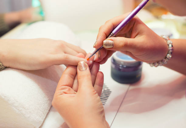 istock Manicurist making artificial nails in the nail salon 1202519557