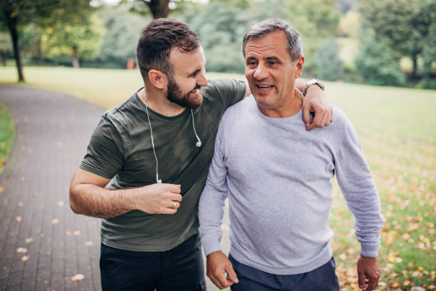 istock Father and son doing morning jogging in a public park 1202519717