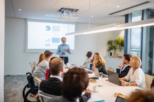 Diverse Businesspeople Listening to Presentation