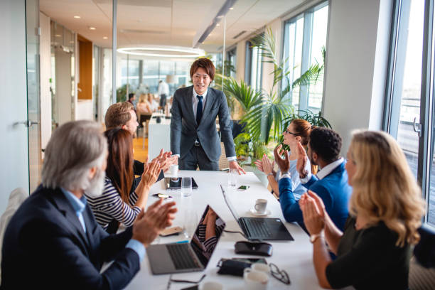 istock Japanese Businessman Smiling at Completion of Presentation 1202520770