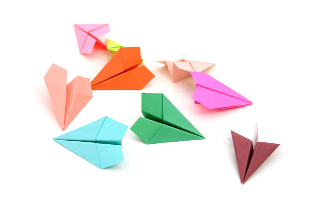 istock Colored paper airplanes isolated on white background 1202523746