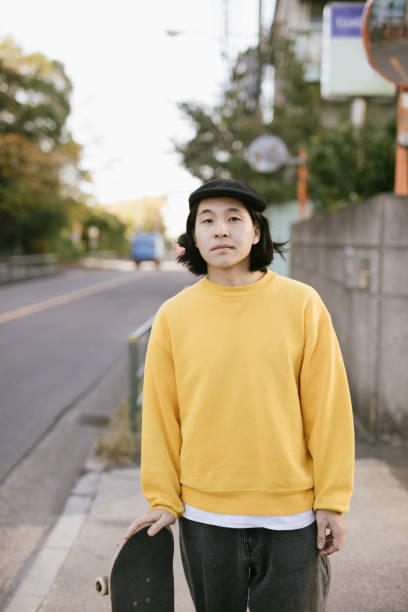 istock Portrait of Asian Skateboarder 1202525628