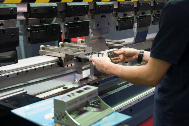 istock Operation of press brake hydraulic bending machine with forming die by skill operator. 1202528726