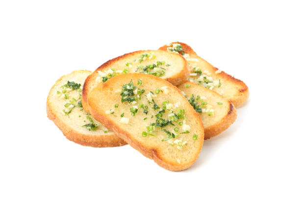 istock Toasted bread slices with garlic isolated on white background 1202530914