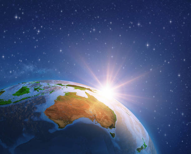 Sun shining over Australia from space Surface of the Planet Earth viewed from a satellite, focused on Australia, sun rising on the horizon. 3D illustration (Blender software) - Elements of this image furnished by NASA (https://eoimages.gsfc.nasa.gov/images/imagerecords/73000/73776/world.topo.bathy.200408.3x5400x2700.jpg). australasia stock pictures, royalty-free photos & images