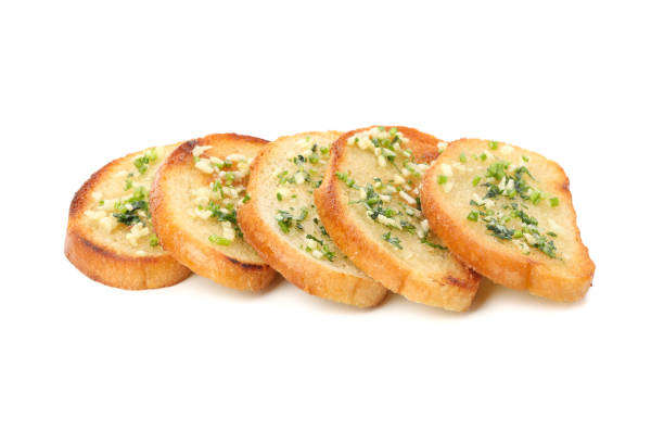 istock Toasted bread slices with garlic isolated on white background 1202531998