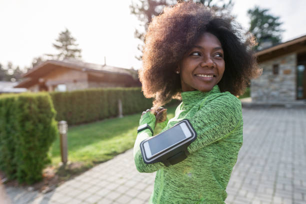 istock Woman warming up before starting her morning jogging 1202532048