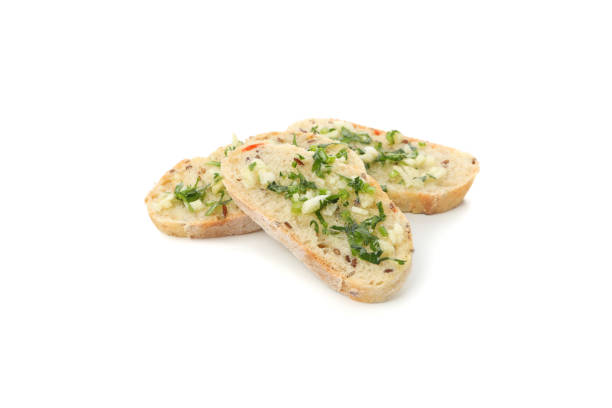 istock Toasted bread slices with garlic isolated on white background 1202532320