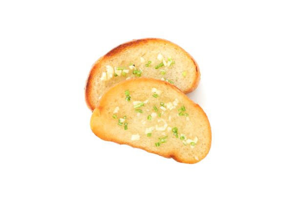 istock Toasted bread slices with garlic isolated on white background 1202532463