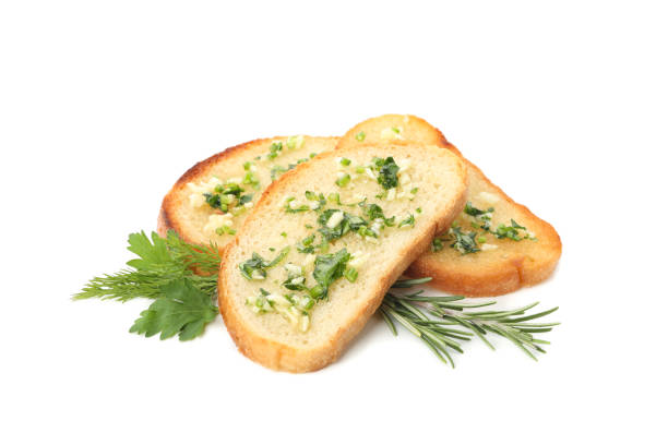 istock Toasted bread slices with garlic isolated on white background 1202533105