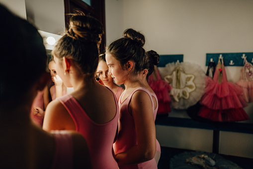 Photo of little ballerinas in a dressing room before  
the performance