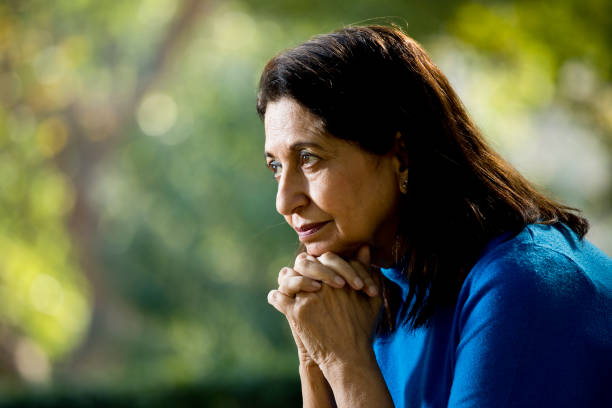 istock Thoughtful old woman at park 1202534891