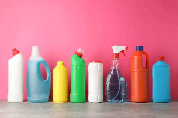 istock Bottles with detergent on pink background, space for text 1202535336