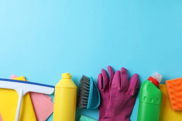 istock Bottles with detergent and cleaning supplies on blue background, space for text 1202535862