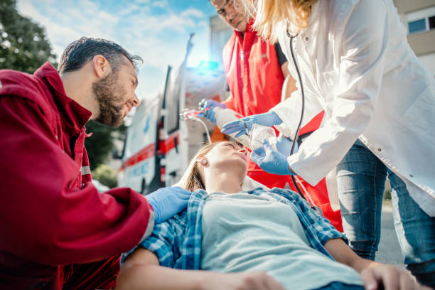 istock Doctor and paramedics helping woman 1202537267