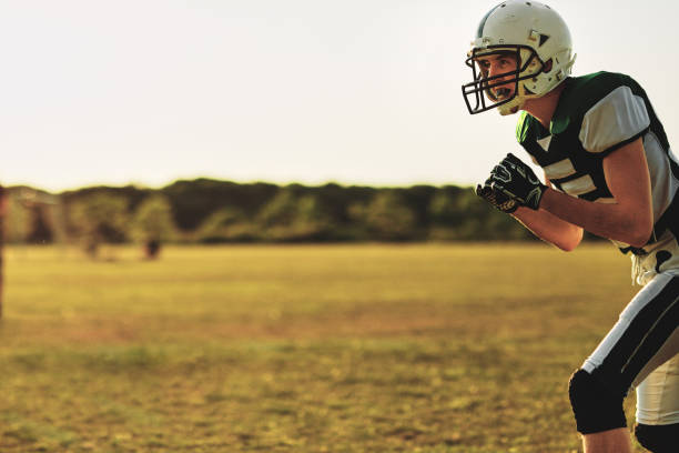 istock Football receiver waiting for a throw during team practice 1202538068