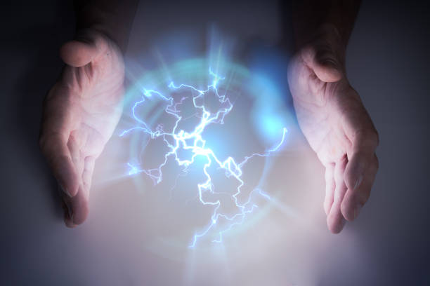 istock Plasma or electric lightning around hanbds of magician. 1202538145