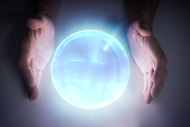 Blonde woman stares intensely into a glowing sphere in a dark, moody setting, creating a mystical and mysterious vibe.