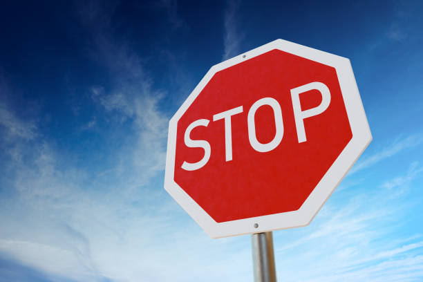 istock Stop traffic sign against blue sky. 3D rendered illustration. 1202538279